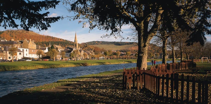 river running alongside a village