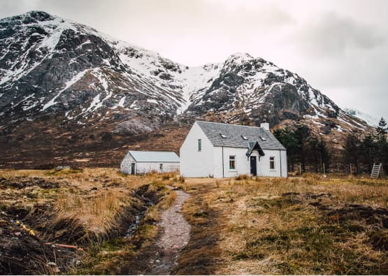 self-catering cottage with snowy mountains in background