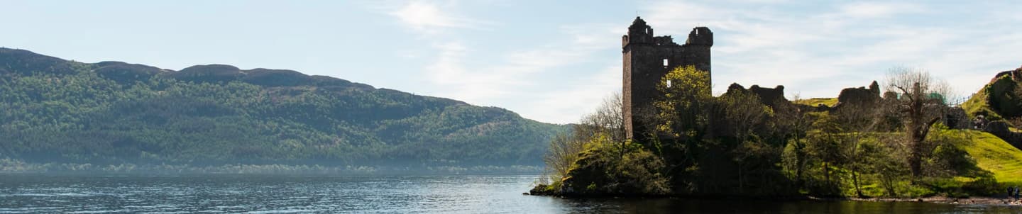 wide angle of castle by loch ness