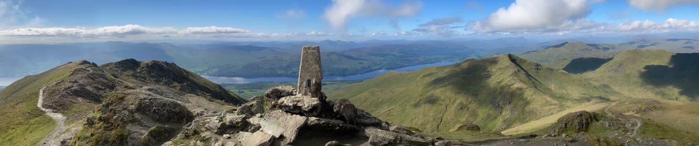 wide angle of guidestone on peak in aberfeldy