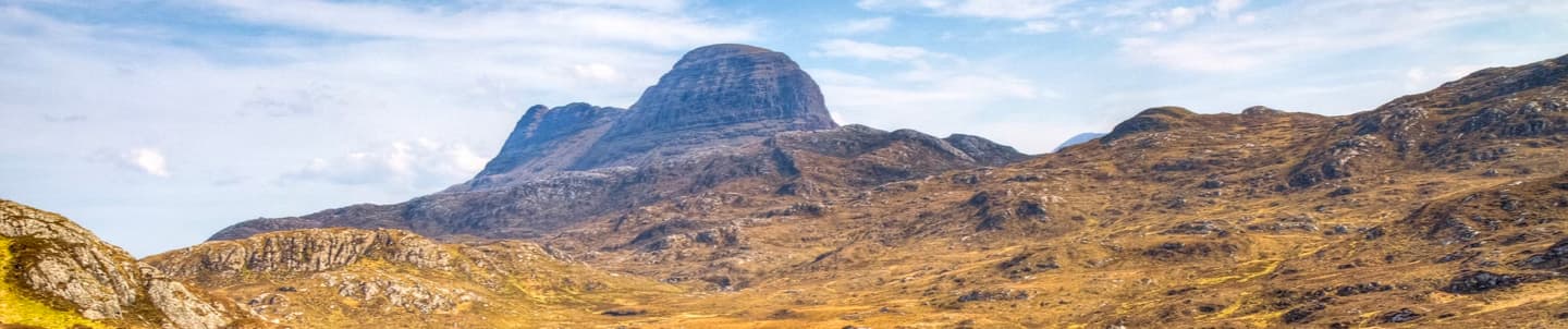 wide angle of rugged hills and mountain in lochinver