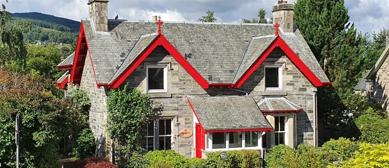Front view of Edengrove surrounded by greenery and open space