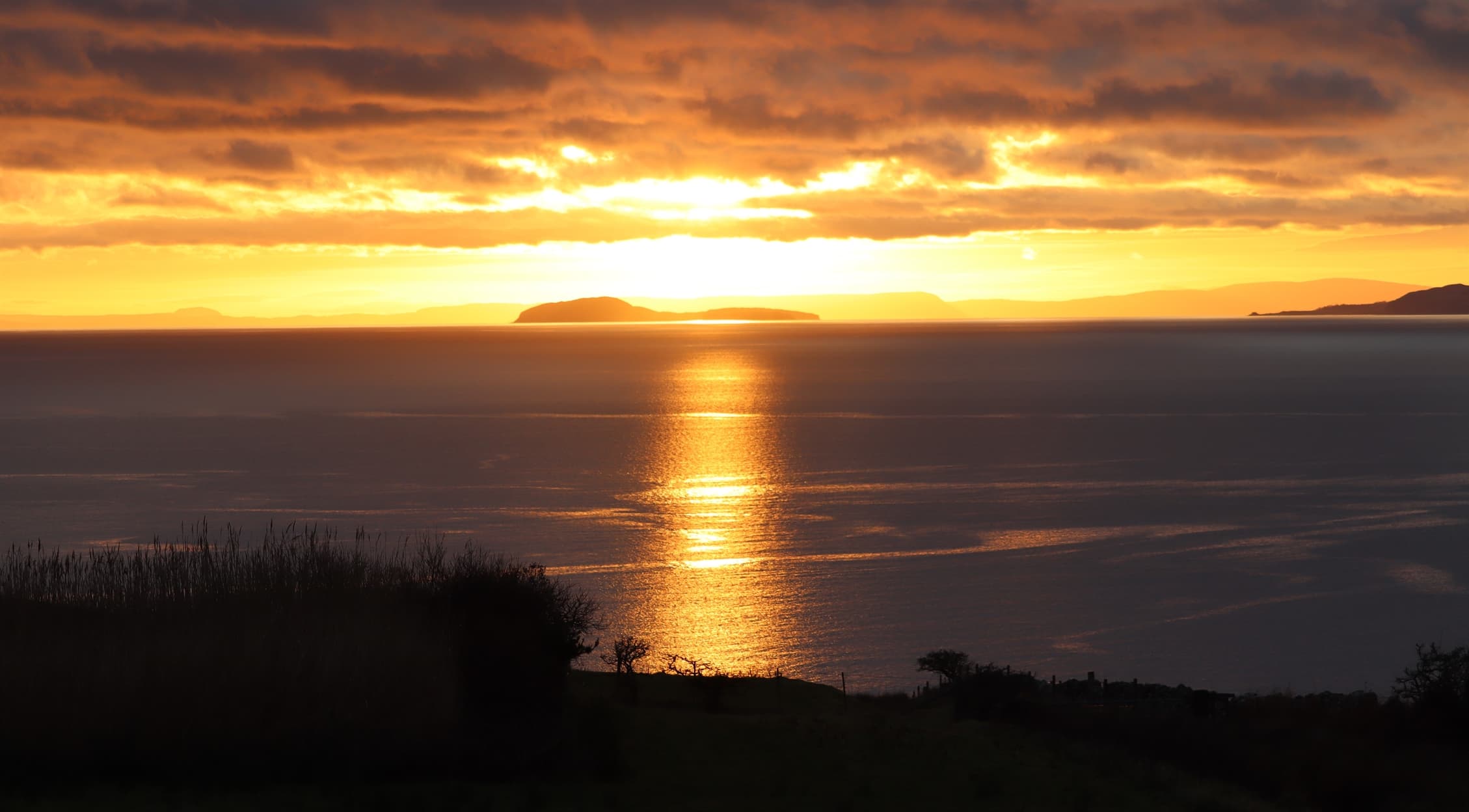 Views from Far Horizons Holiday Cottages - Golden sunset over Sanda