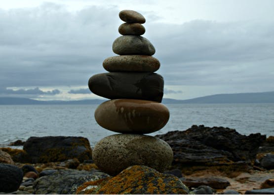stack of stones on rocky beach on the isle of arran
