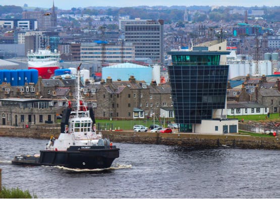 city of aberdeen with boat passing through river