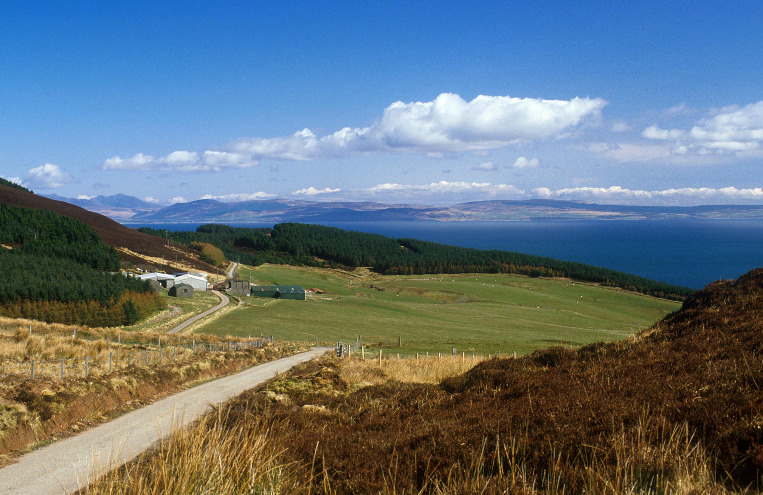 Looking East Down A Single Track Road On The Kintyre Peninsula Across The Kilbrannan Sound To The Isle Of Arran
