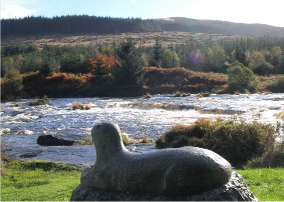 dumfries and galloway river with otter statue in foreground