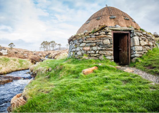 traditional hut with river in outer hebrides