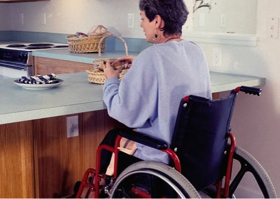 lady in wheelchair in accessible kitchen